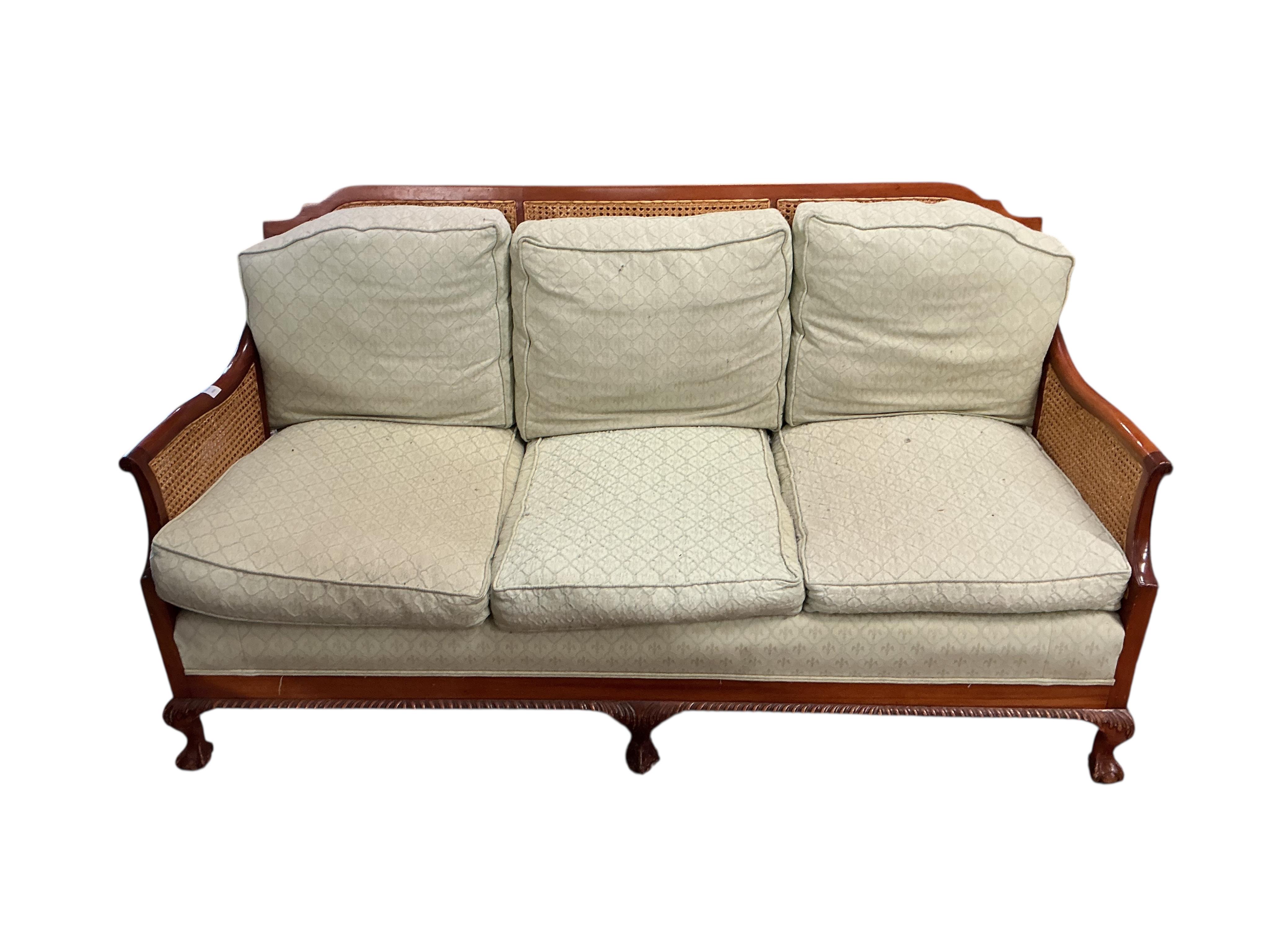 A mahogany double caned bergere settee with loose cushion seat and back, width 178cm, depth 78cm, height 87cm